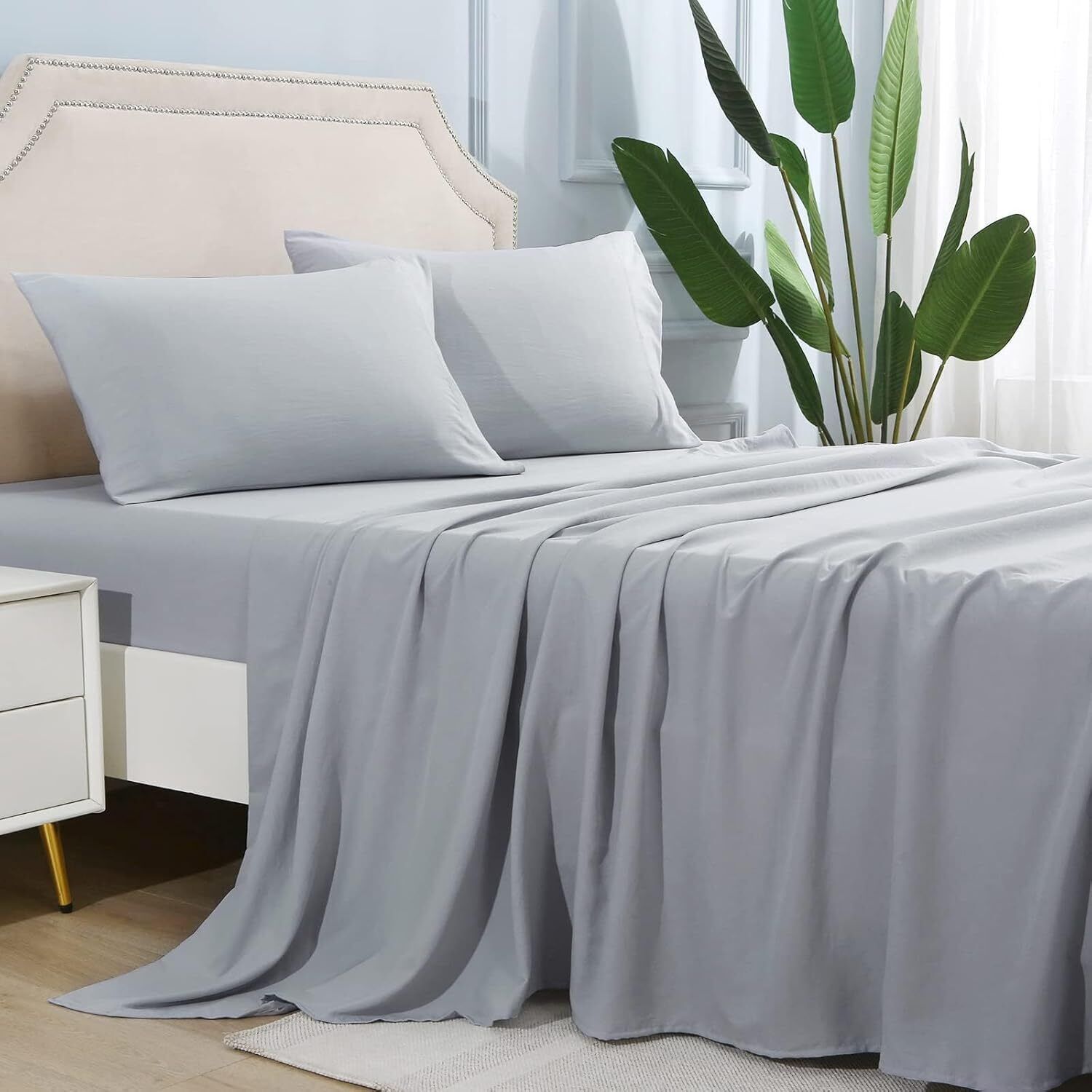 Shopi Vella microfiber bed sheet set in light gray on a bed with matching pillowcases