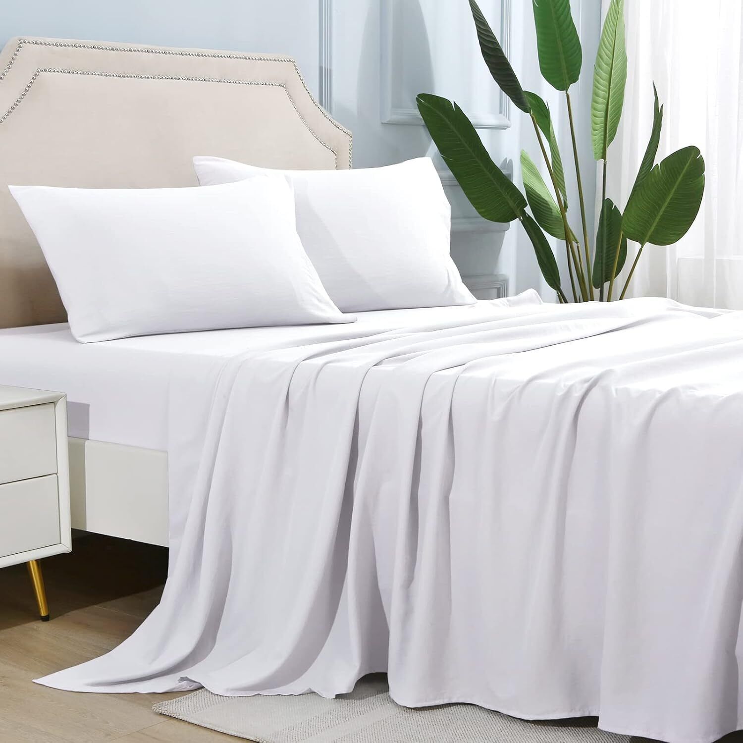 Shopi Vella white microfiber bed sheet set neatly arranged on a bed with pillows in a modern bedroom