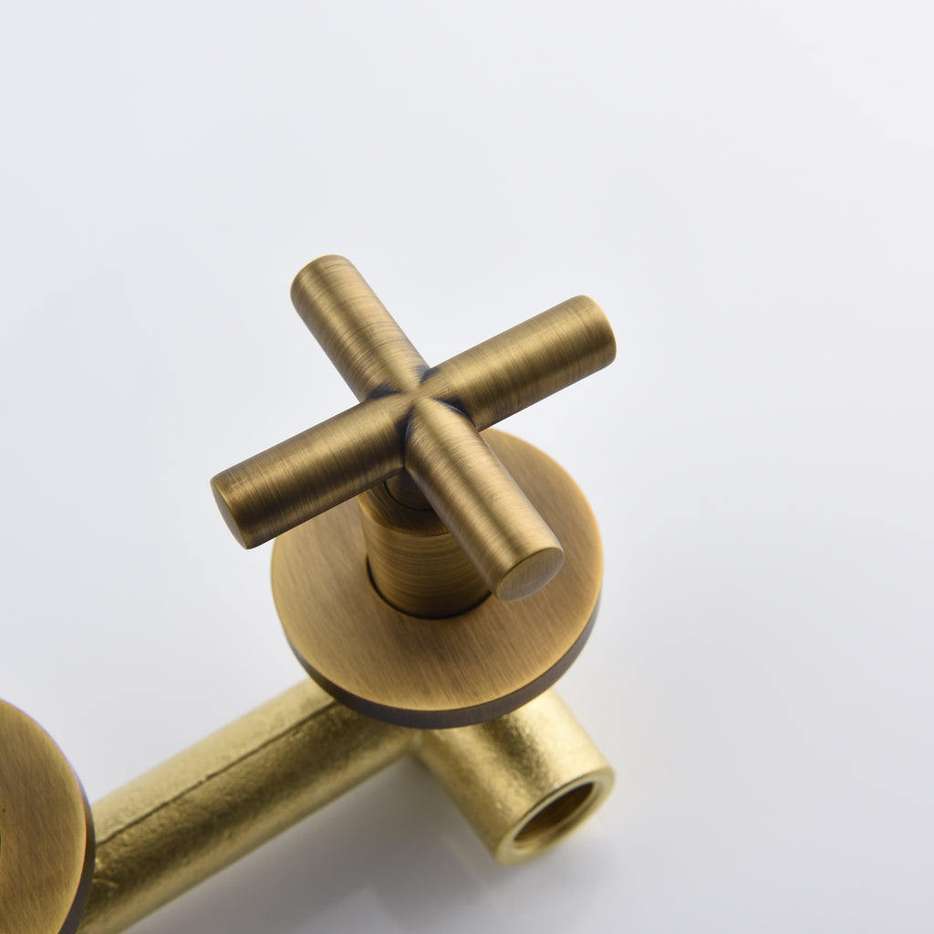 Shopi Vella wall mounted bathroom faucet with antique brass finish and cross handle design