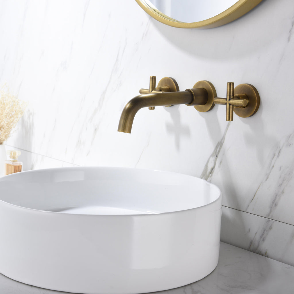 Shopi Vella wall mounted bathroom faucet in brushed brass with white round vessel sink and marble wall background
