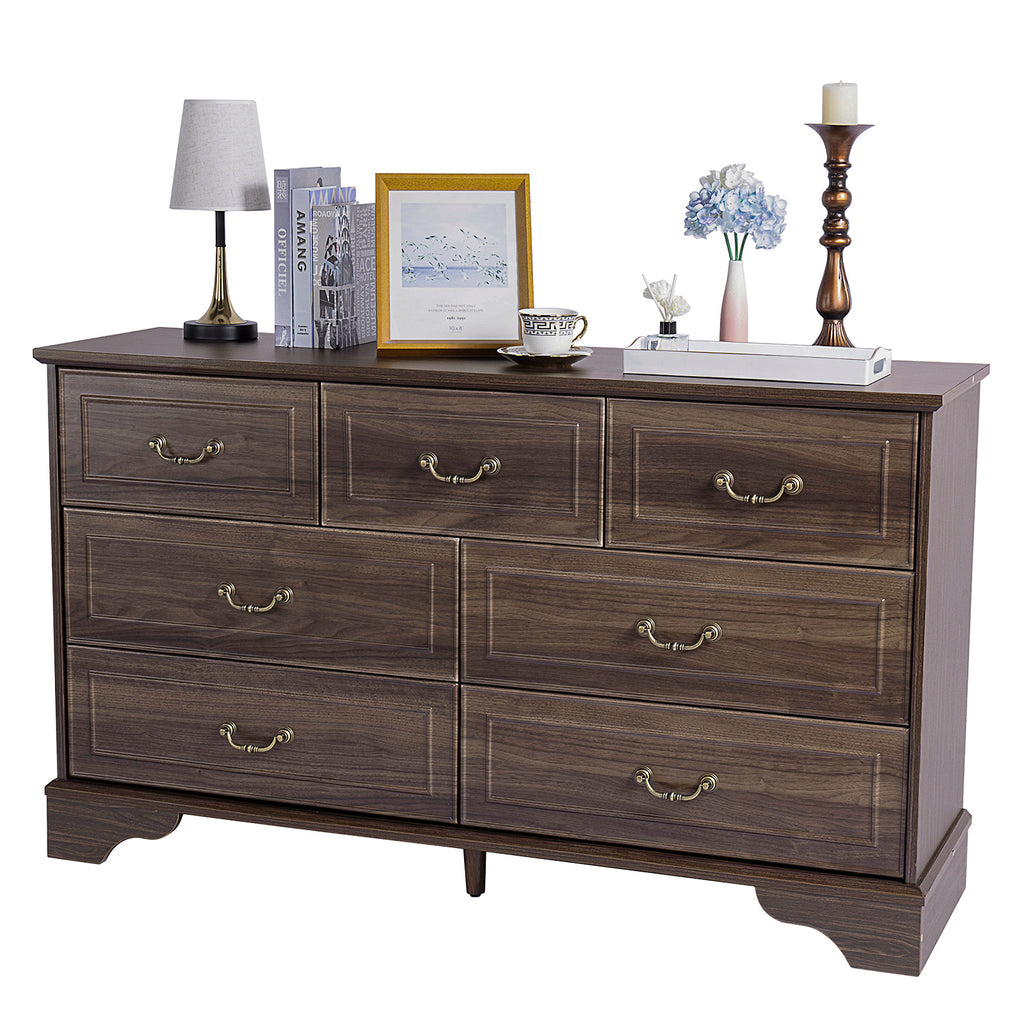 Shopi Vella brown 7-drawer chest of drawers with brass handles and decorative items on top