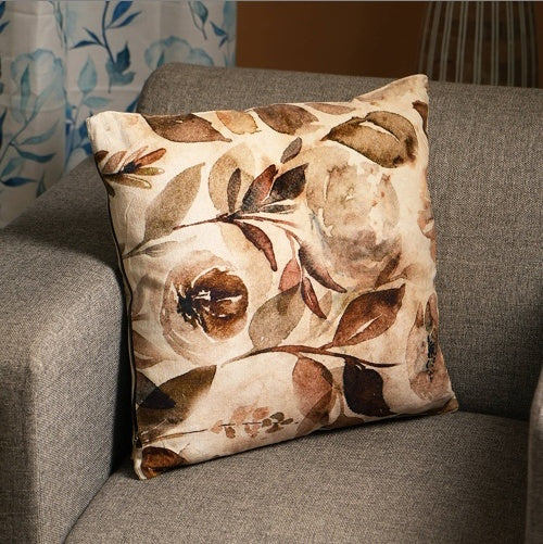 Shopi Vella 18 inch cotton pillow case with brown and beige floral design on gray sofa