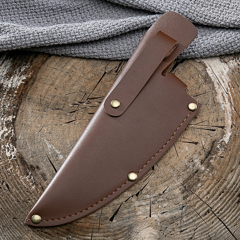 Shopi Vella brown leather sheath for kitchen deboning knife with brass rivets on wooden surface