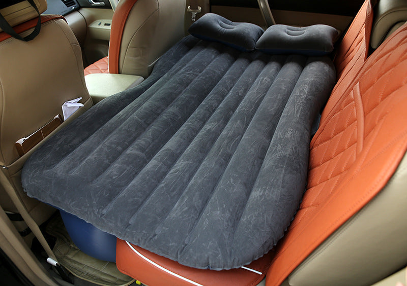 My Store car inflatable bed fully inflated and placed on the backseat of a car with two inflatable pillows
