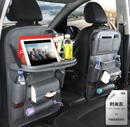 Shopi Vella car seat back storage bag in fashionable grey with multiple pockets holding drinks, tablet, and tissues