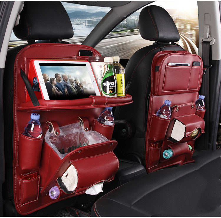 Shopi Vella car seat back storage bag in red leather with multiple compartments for tablets bottles and tissues
