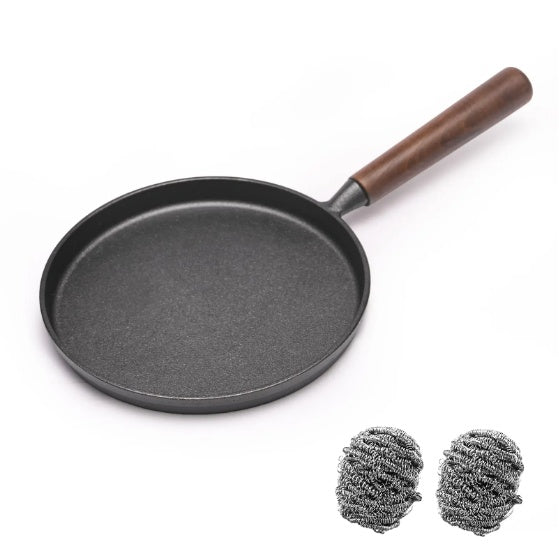 Shopi Vella cast iron pizza pan with wooden handle and two metal scrubbers for easy cleaning