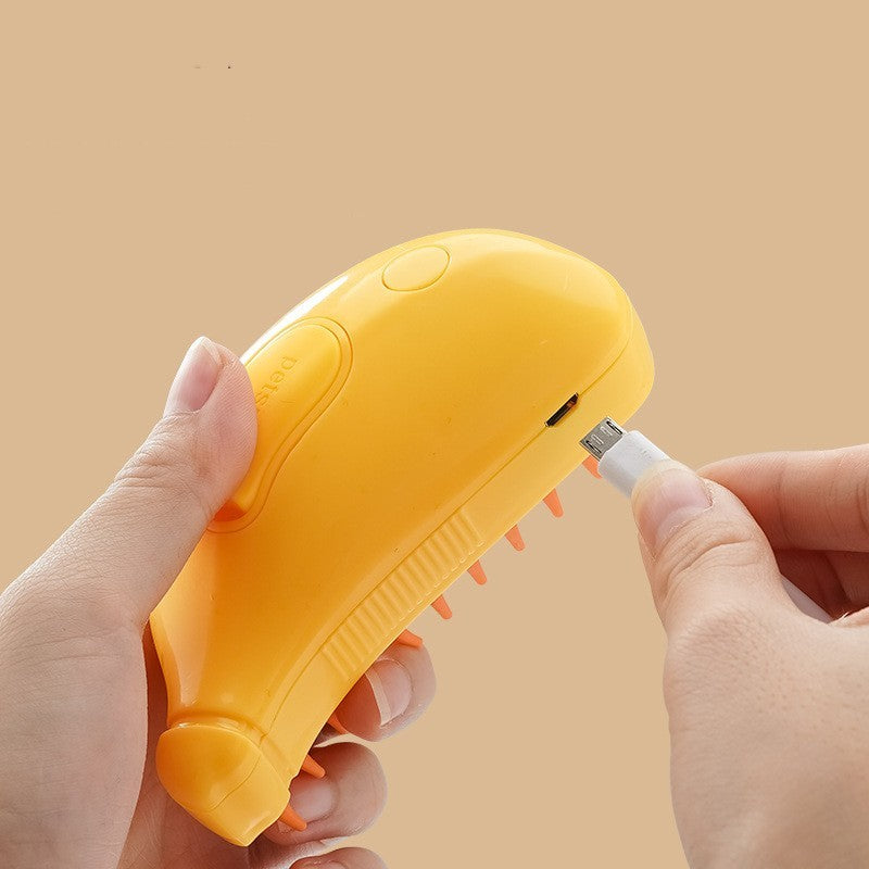 Shopi Vella yellow rechargeable cat and dog hair removal comb with ergonomic design being plugged in for charging