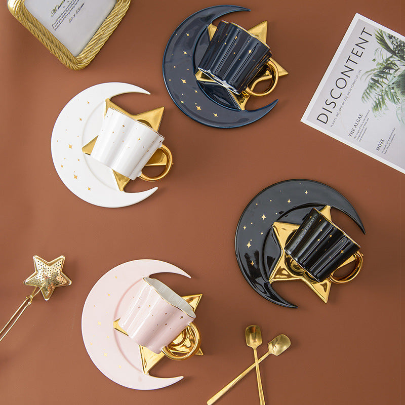 Shopi Vella ceramic cup with star and moon saucer in black white and pink with gold accents