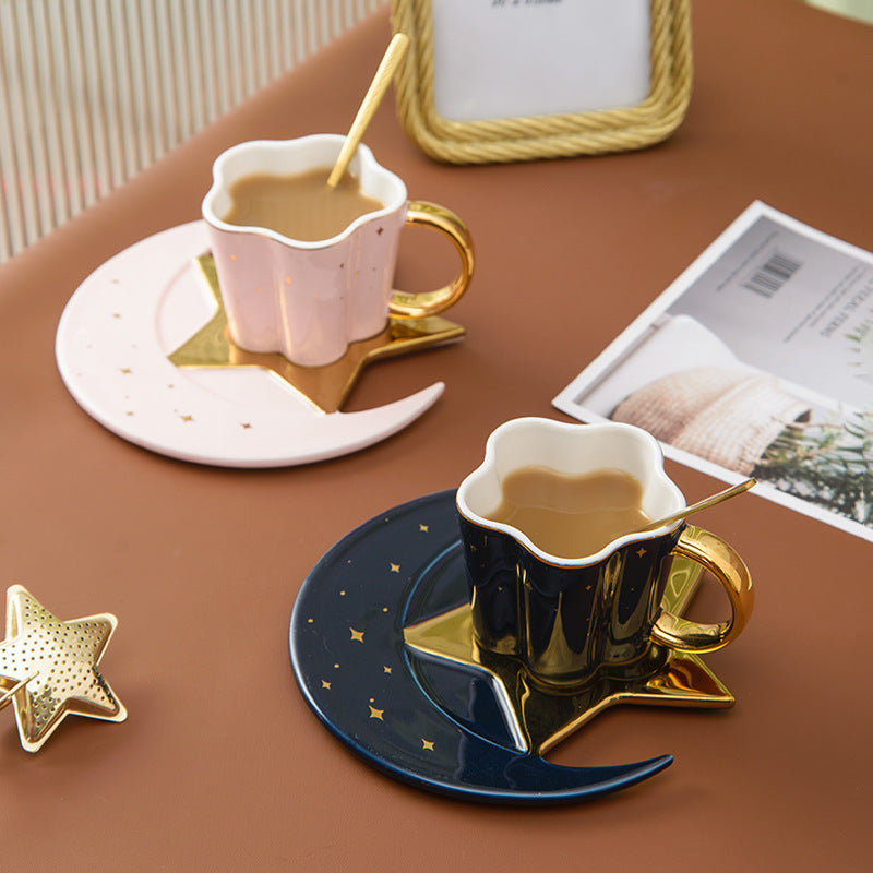 Shopi Vella ceramic cup with star and moon saucer set in black and white with gold accents
