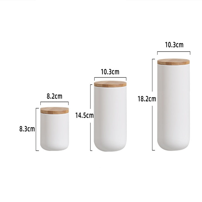 Set of three ceramic kitchen storage jar containers with wooden lids in varying sizes from Shopi Vella