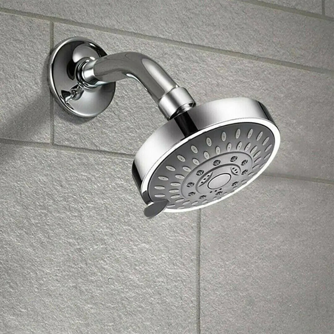 Chrome high pressure handheld shower head mounted on tiled bathroom wall for powerful water flow