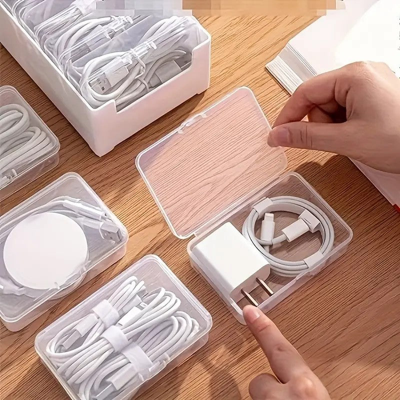 Shopi Vella clear plastic storage box set organizing white charging cables and adapter on wooden surface