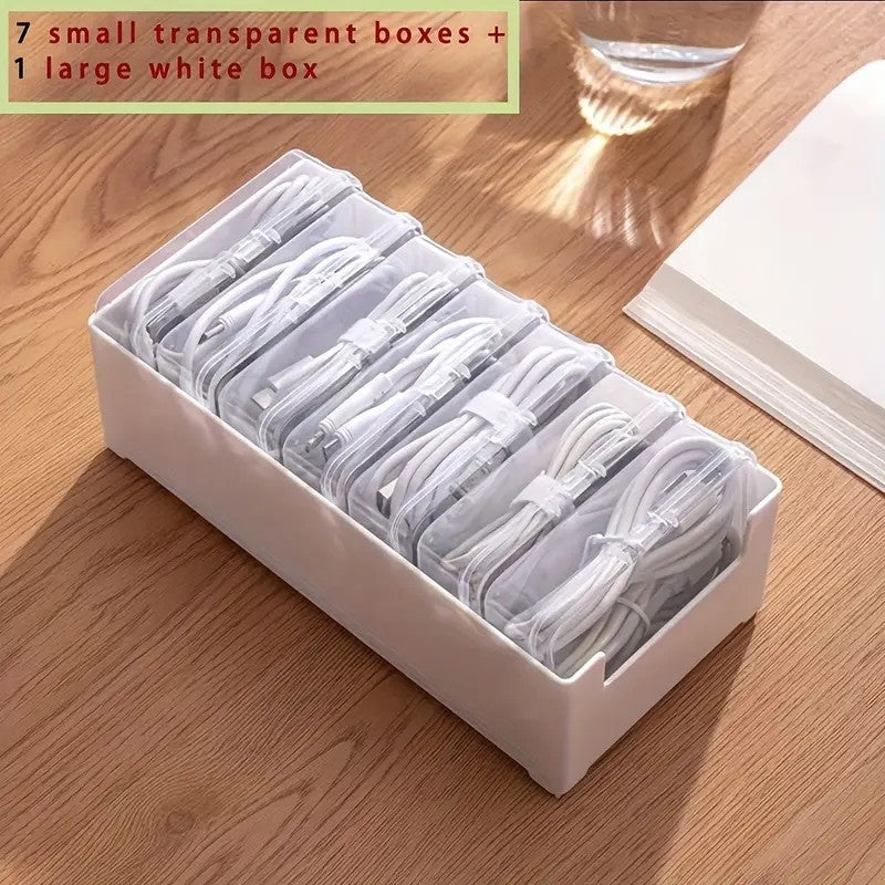 Shopi Vella clear plastic storage box set with 7 small transparent boxes and 1 large white box organizing cables