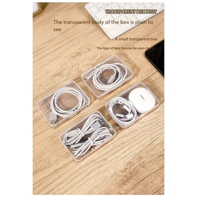 Shopi Vella clear plastic storage box set holding various white charging cables and accessories on wooden surface