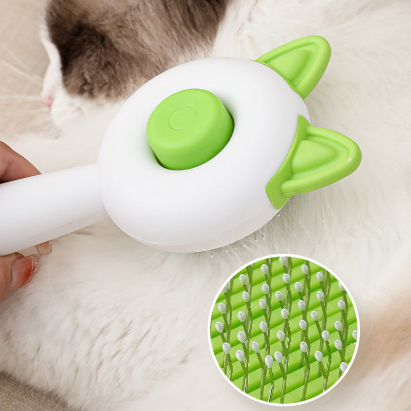 Shopi Vella self cleaning pet brush with green silicone bristles grooming white cat fur