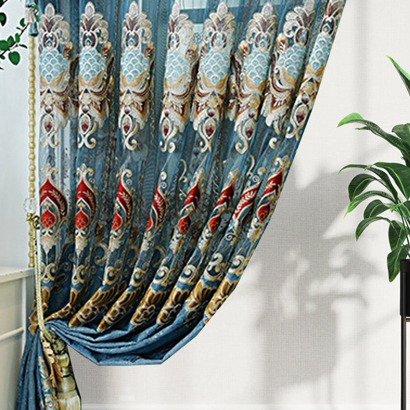 Shopi Vella modern velvet living room curtains with intricate blue and gold pattern draped elegantly