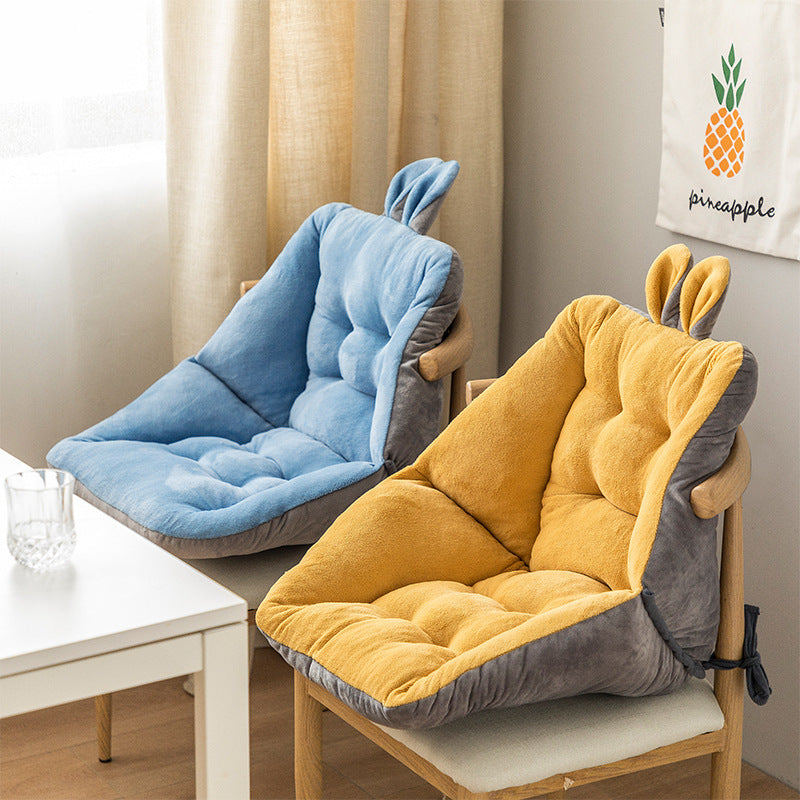Comfortable seat cushion for home office in blue and yellow with bunny ear design on wooden chairs