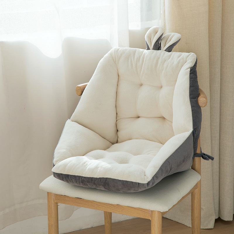 Comfortable seat cushion for home office in white and gray on wooden chair near window
