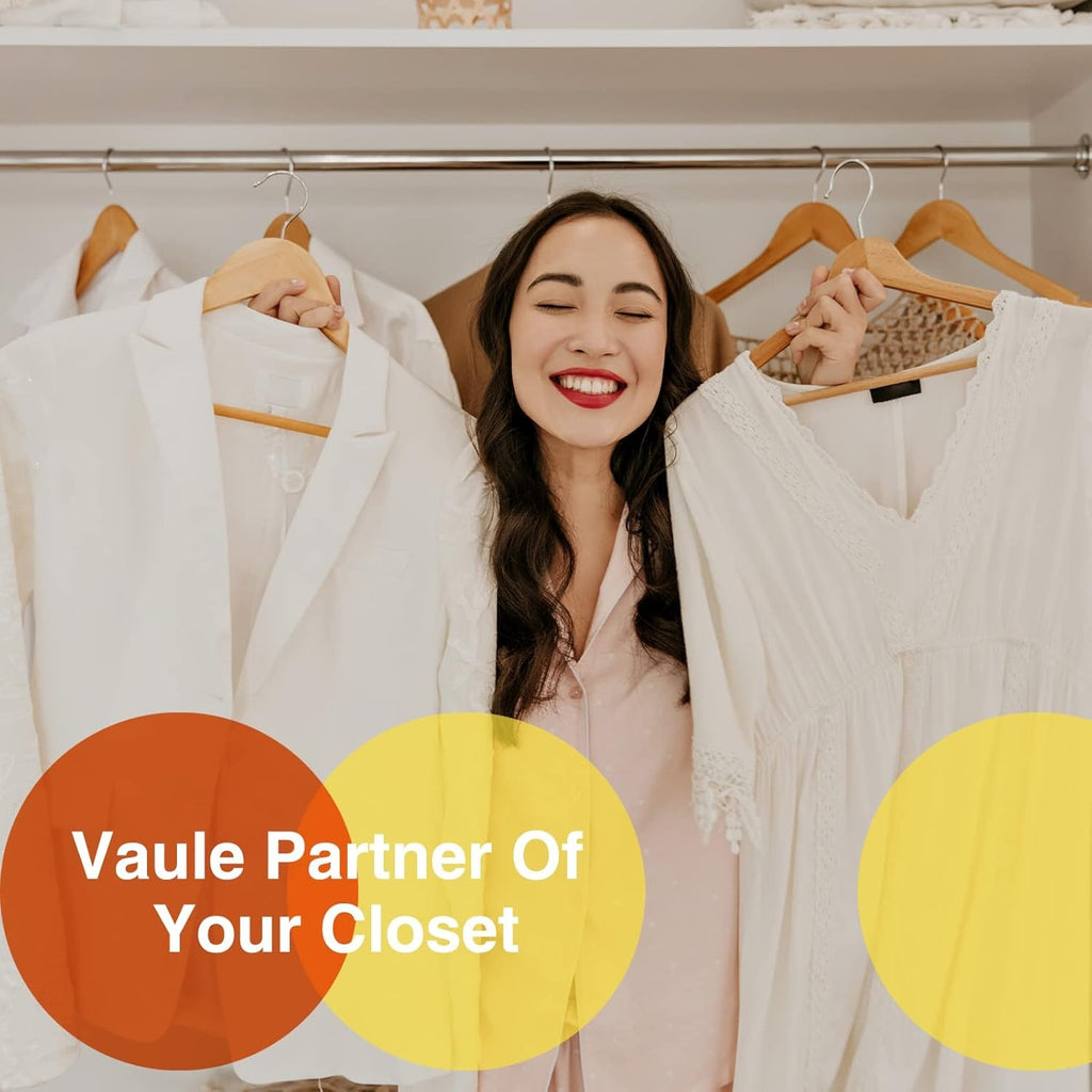 Shopi Vella commercial grade wood hangers set holding white clothing in a closet with a smiling woman