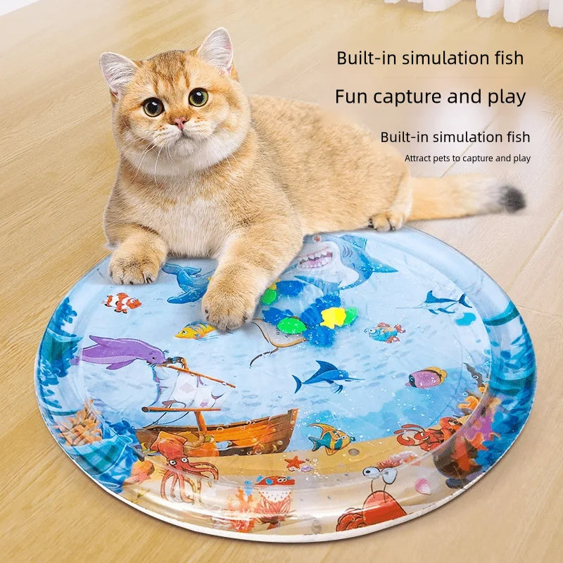 Cat playing on a colorful water-themed toy, not a cooling pet bed for summer
