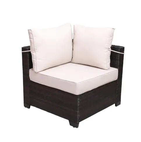 Corner chair with dark wicker frame and white cushions from 7 piece outdoor patio furniture set