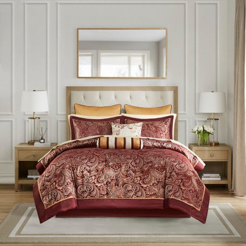 Cotton bed sheets comforter set with paisley design in burgundy and gold on a bed with beige headboard