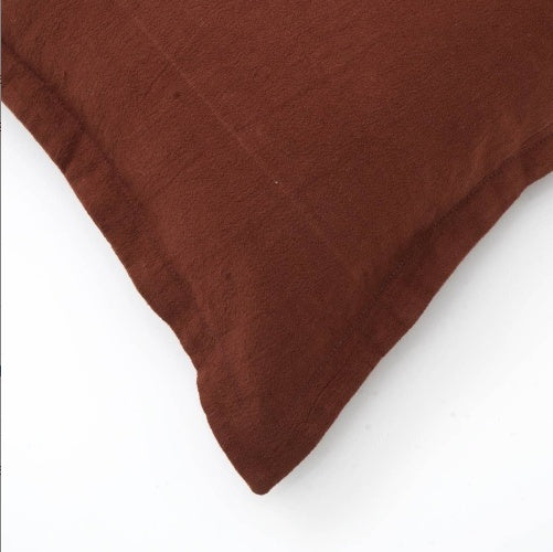 Shopi Vella brown pillow case featuring a cotton cushion with flanges for a stylish finish