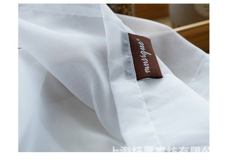 Shopi Vella white soft fabric cotton linen window curtains close-up with brown label