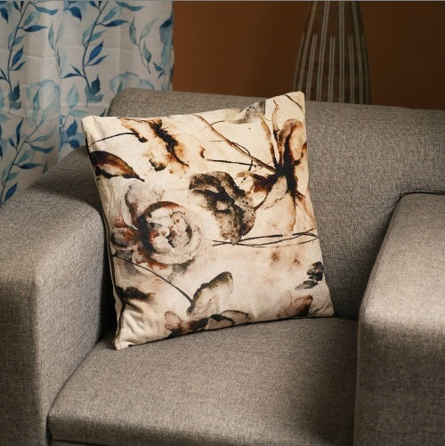Shopi Vella 18 inch cotton pillow with abstract floral design on a gray sofa