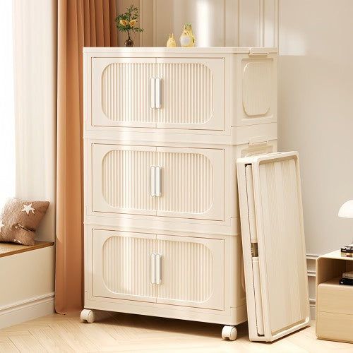 Shopi Vella cream white folding storage cabinet with three compartments and rolling wheels in a modern room
