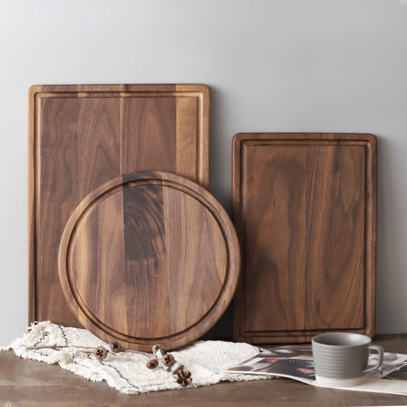 Creative wood cutting board for kitchen set with rectangular and round boards on table with cup and cloth