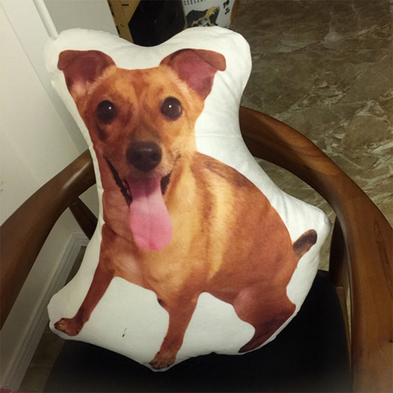 Shopi Vella custom pet pillow featuring a brown dog printed on a white pillow case shaped like the pet