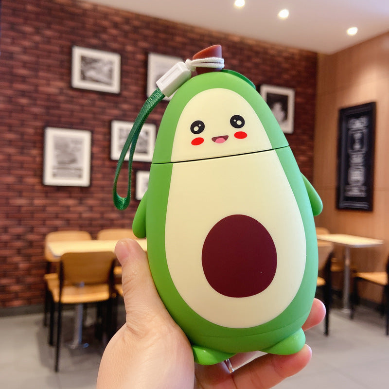 Shopi Vella cute avocado glass container with smiling face design held in hand indoors