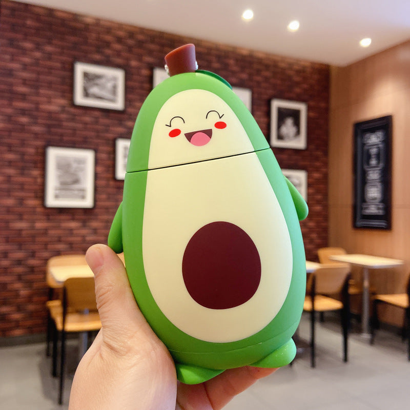 Shopi Vella cute avocado glass container with smiling face held in hand for home storage