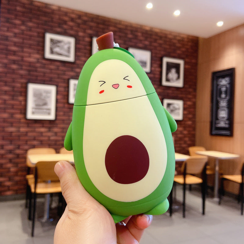 Cute avocado glass container shaped like a smiling avocado held in hand for home storage