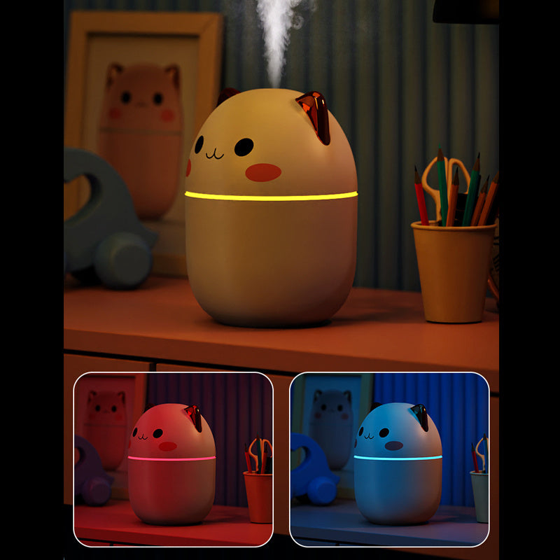 Cute cat air humidifier by Shopi Vella with night light feature on a desk with stationery