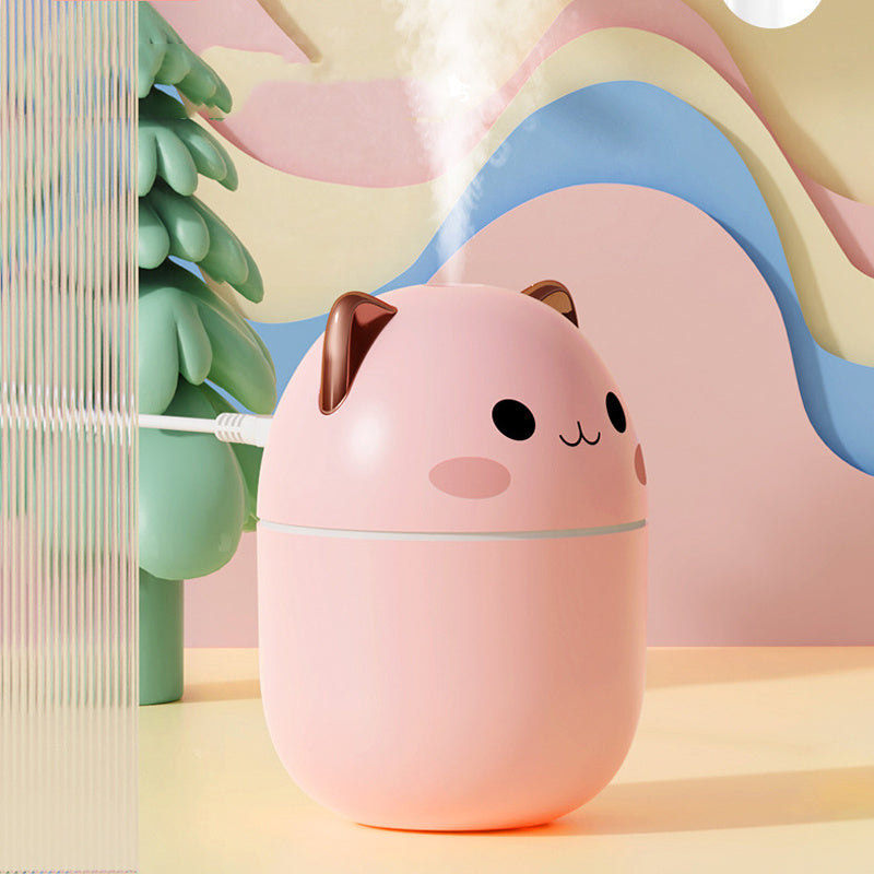 Shopi Vella cute cat air humidifier in pink with smiling face and brown ears releasing mist