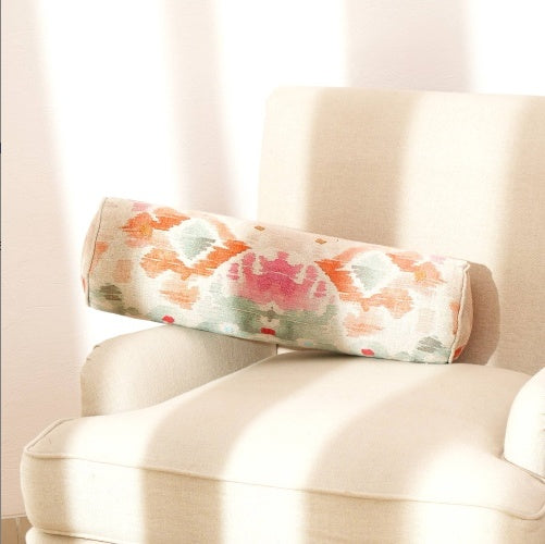 Shopi Vella decorative bolster pillow case with colorful floral pattern on beige chair