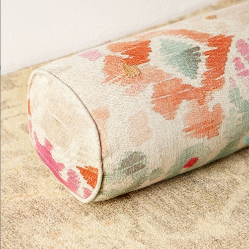 Shopi Vella decorative bolster pillow case with colorful abstract floral pattern on beige fabric