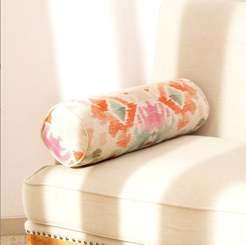 Shopi Vella decorative bolster pillow case with colorful floral pattern on beige sofa