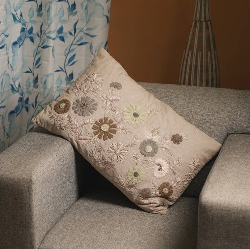 Shopi Vella decorative floral pillow for sofa with embroidered flowers in neutral tones on beige fabric