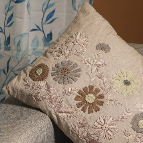 Shopi Vella decorative floral pillow for sofa with intricate embroidered flowers in neutral tones