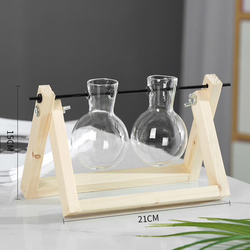 Shopi Vella decorative glass vase for indoor plants with two clear glass bulbs on wooden stand