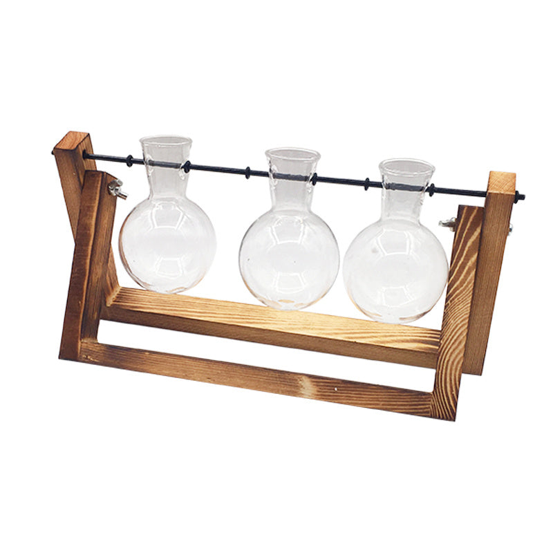 Shopi Vella decorative glass vase for indoor plants with three round glass bottles in a wooden frame