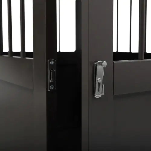 Close-up of latch and lock mechanism on black dog kennel end table door for secure pet enclosure