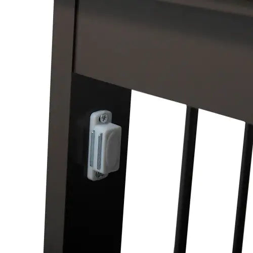 Close-up of latch detail on black wooden dog kennel end table for secure closure