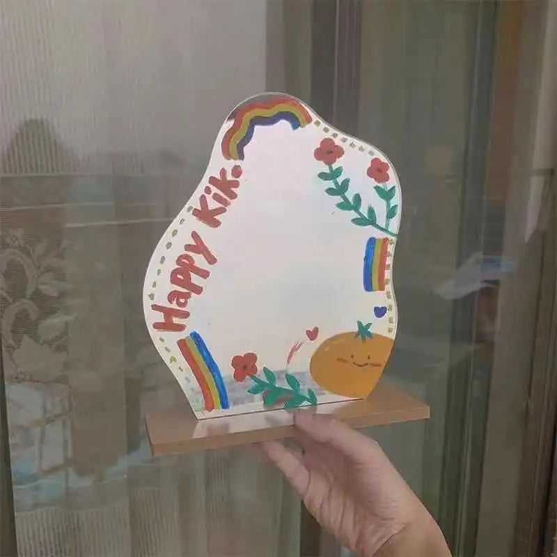 Cute hand-held dorm decor vanity mirror with colorful rainbows and floral designs on wooden base