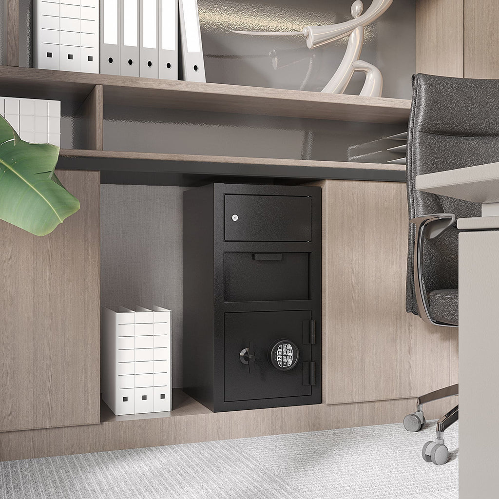 Black double door digital depository safe placed under office desk next to file folders