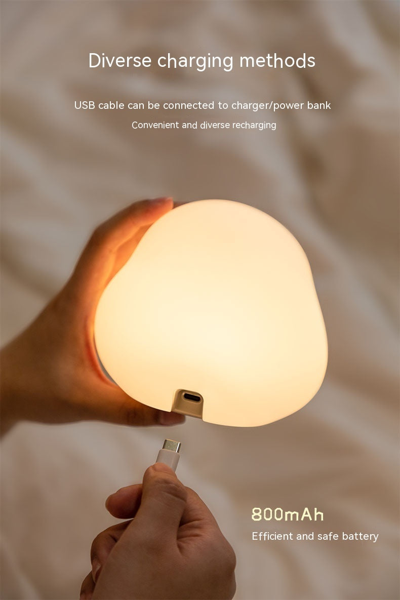 Shopi Vella cartoon LED sleeping light being charged with USB cable showing diverse charging methods